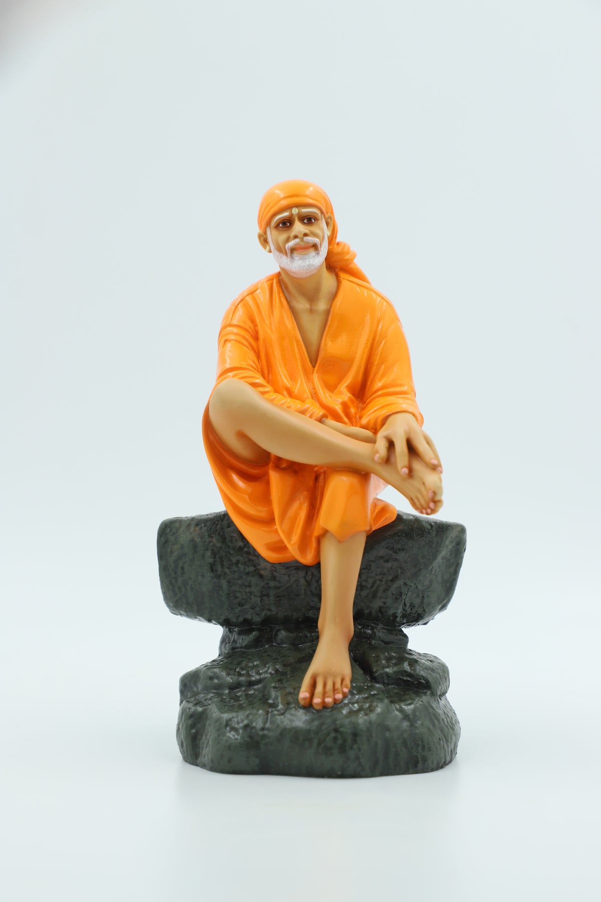 Saibaba Sitting on Stone Idol, Orange, 7.5 Inch Hemant Art