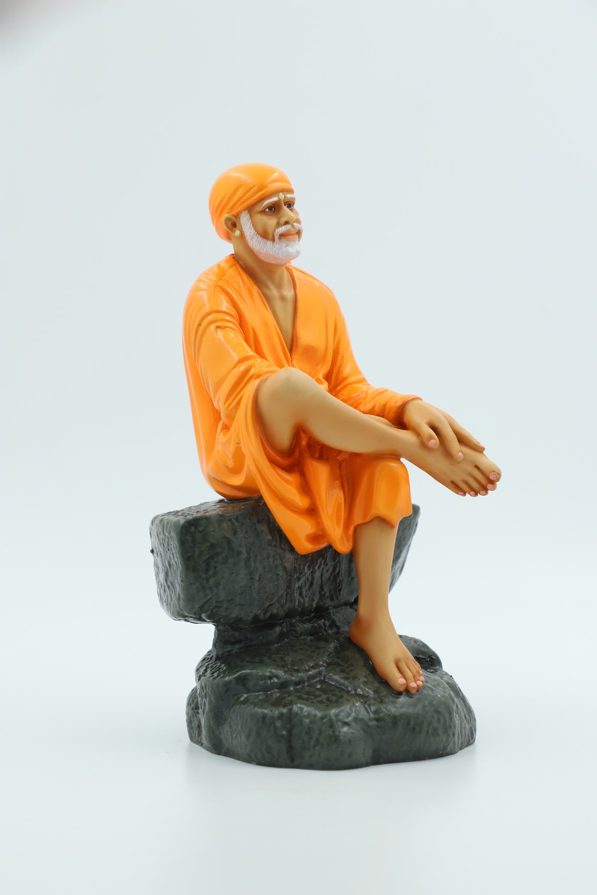 Saibaba Sitting on Stone Idol, Orange, 7.5 Inch Hemant Art