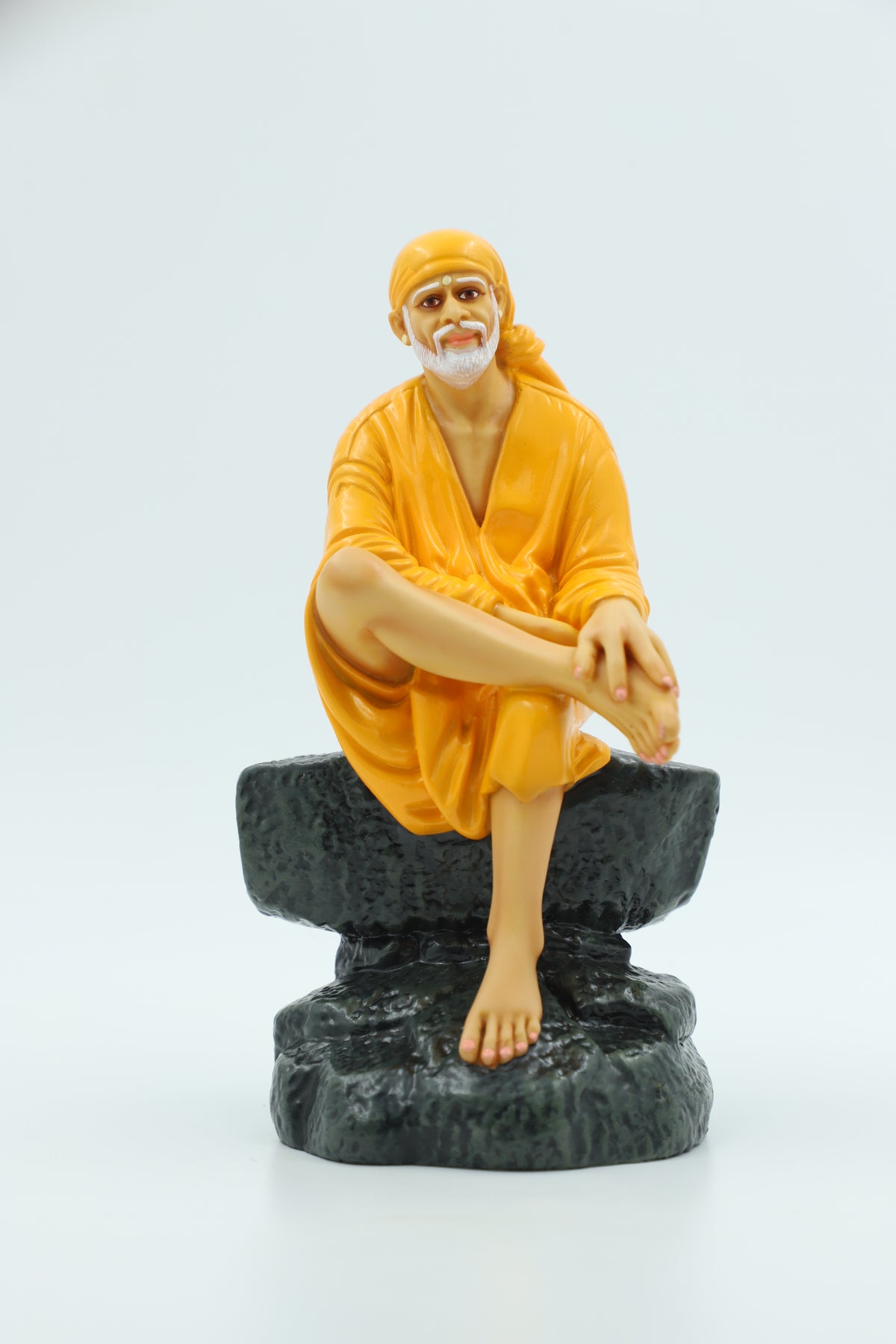 Saibaba Sitting on Stone Idol, Orange, 7.5 Inch Hemant Art