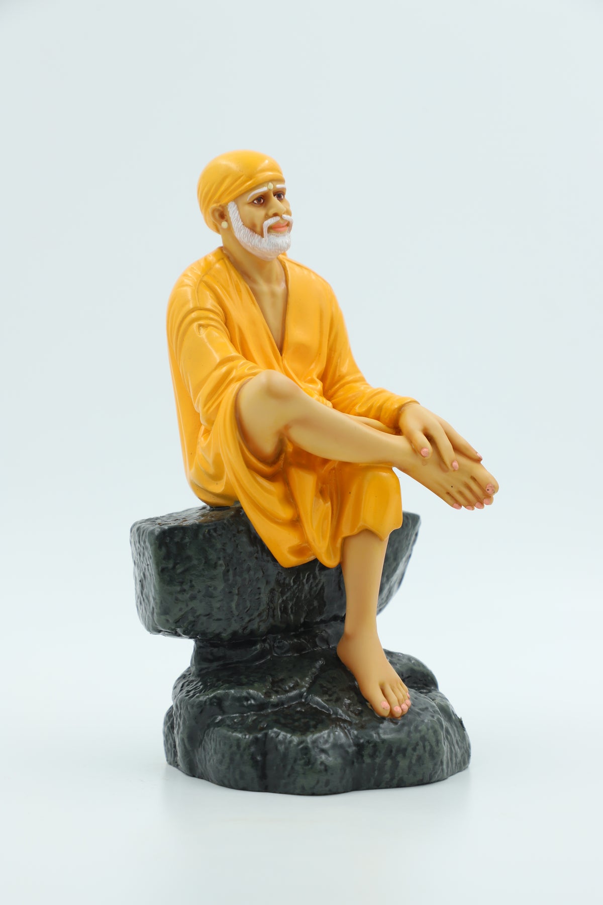 Saibaba Sitting on Stone Idol, Orange, 7.5 Inch Hemant Art