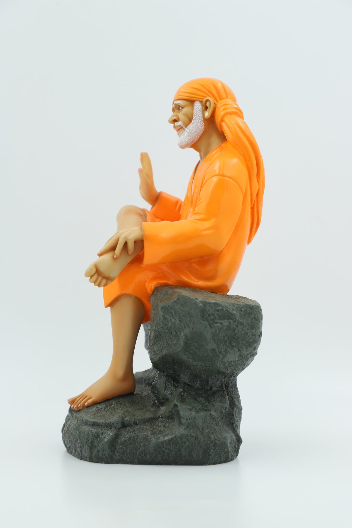 Saibaba Sitting on Stone Idol, Orange, 9 Inch Hemant Art
