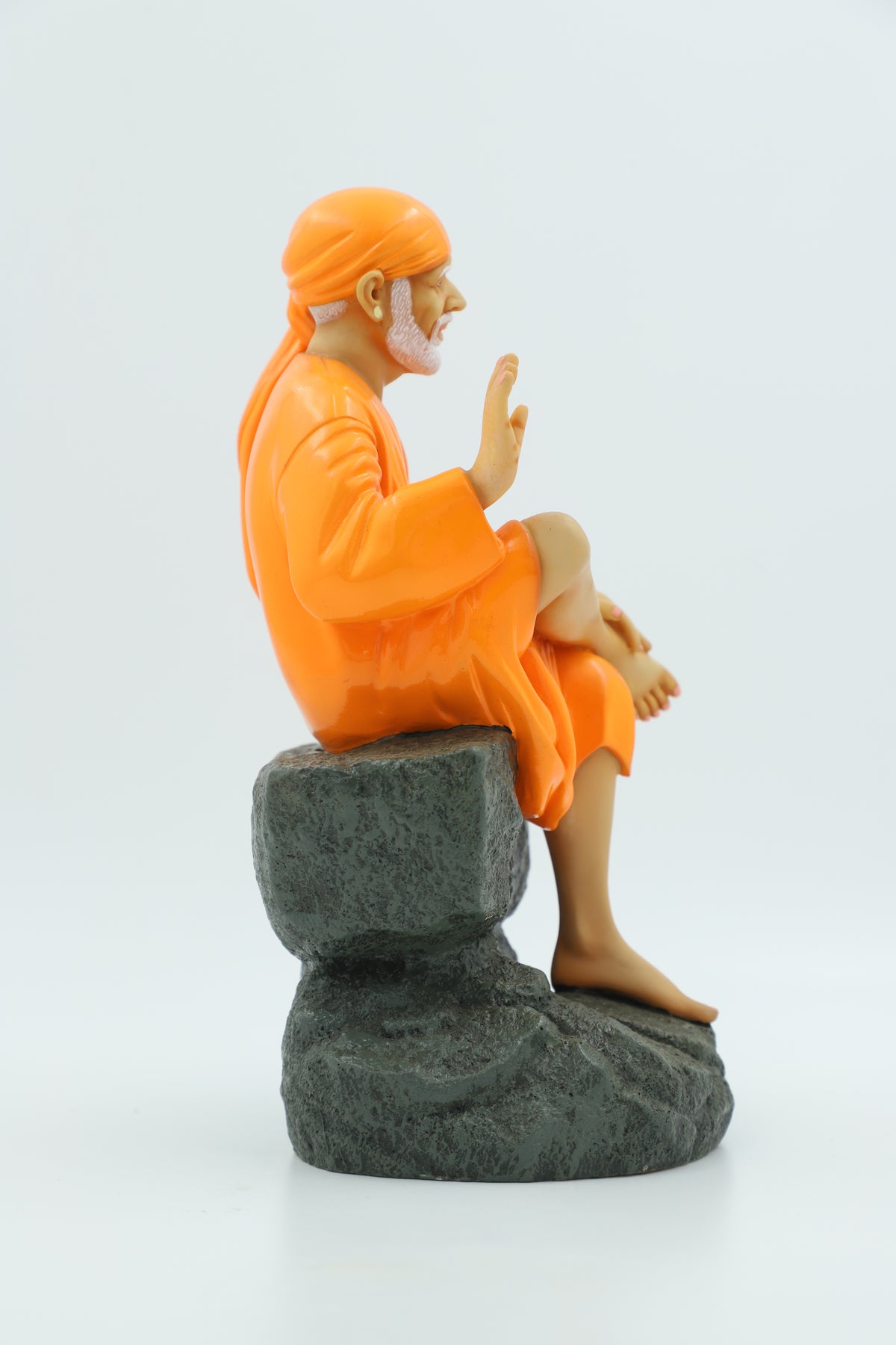 Saibaba Sitting on Stone Idol, Orange, 9 Inch Hemant Art