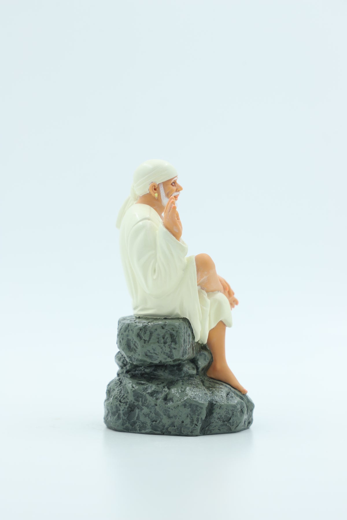 Sai Baba Idol Sitting on Stone, Aashirwad Hand – White 6.5 Inch Hemant Art