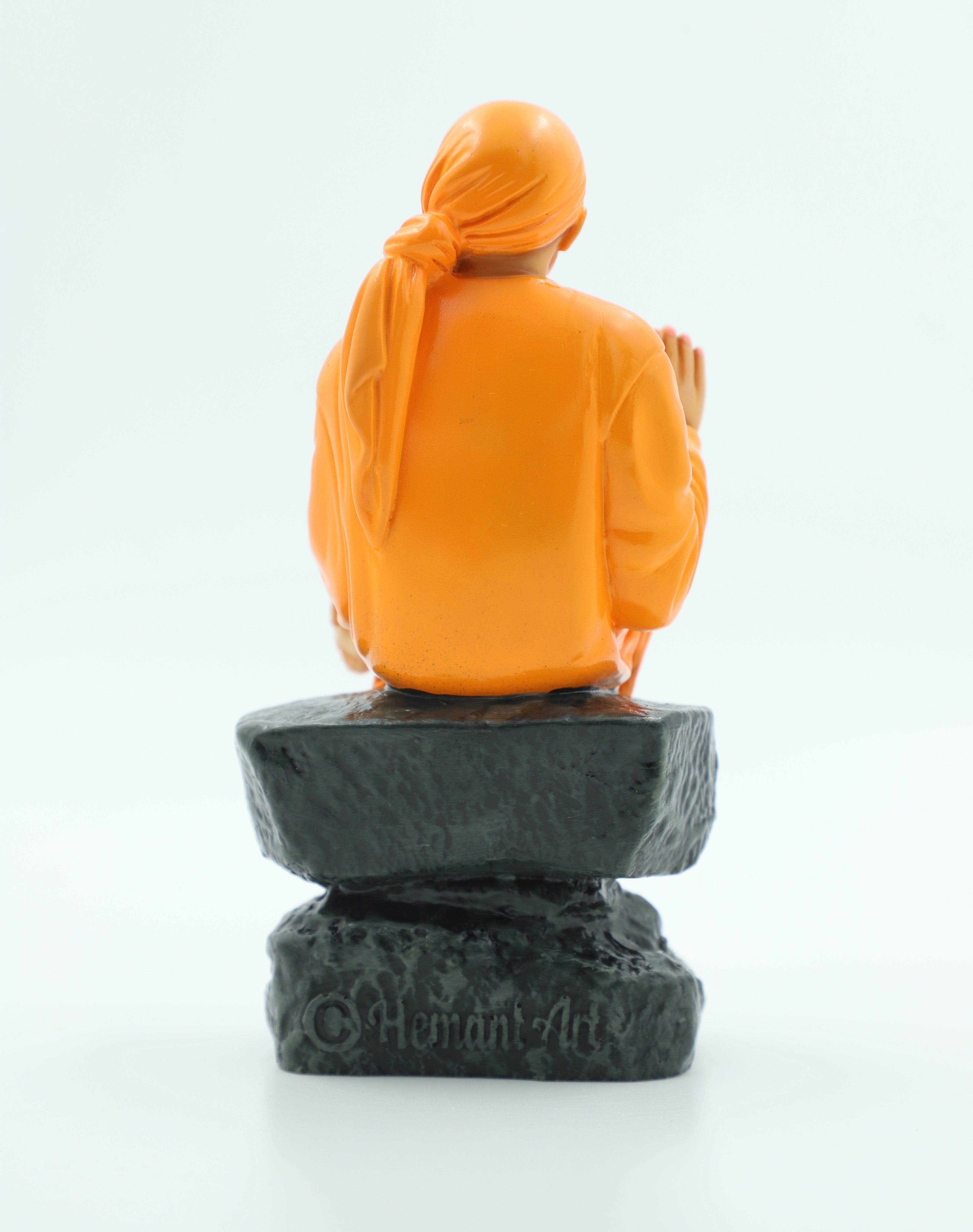🙏 Hemant Art Shirdi Sai Baba Idol🛕 – Sitting on Stone, Aashirwad Hand – 6.5 Inch (Orange ), Handcrafted Resin Murti