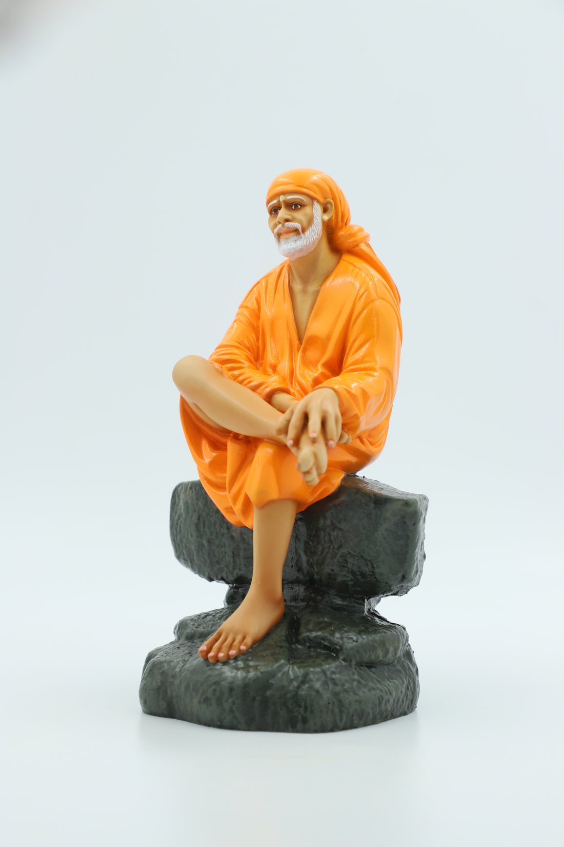 Saibaba Sitting on Stone Idol, Orange, 7.5  Inch Hemant Art