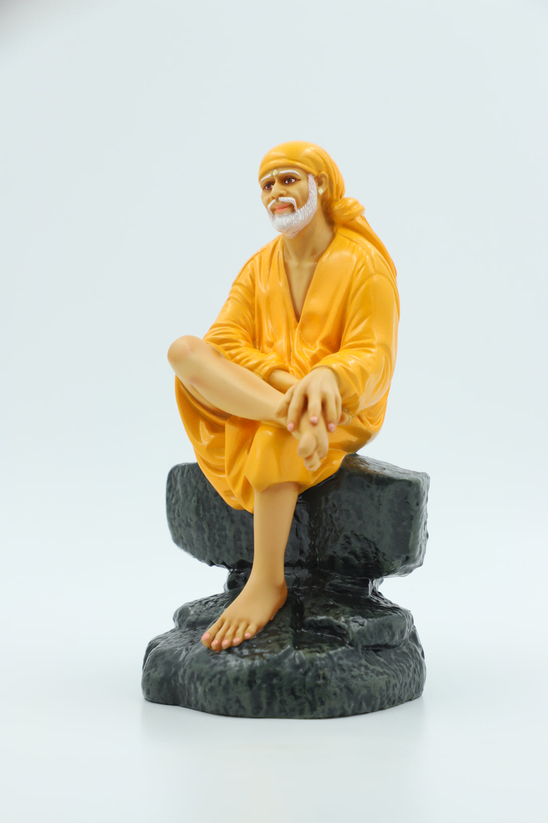 Saibaba Sitting on Stone Idol, Orange, 7.5  Inch Hemant Art