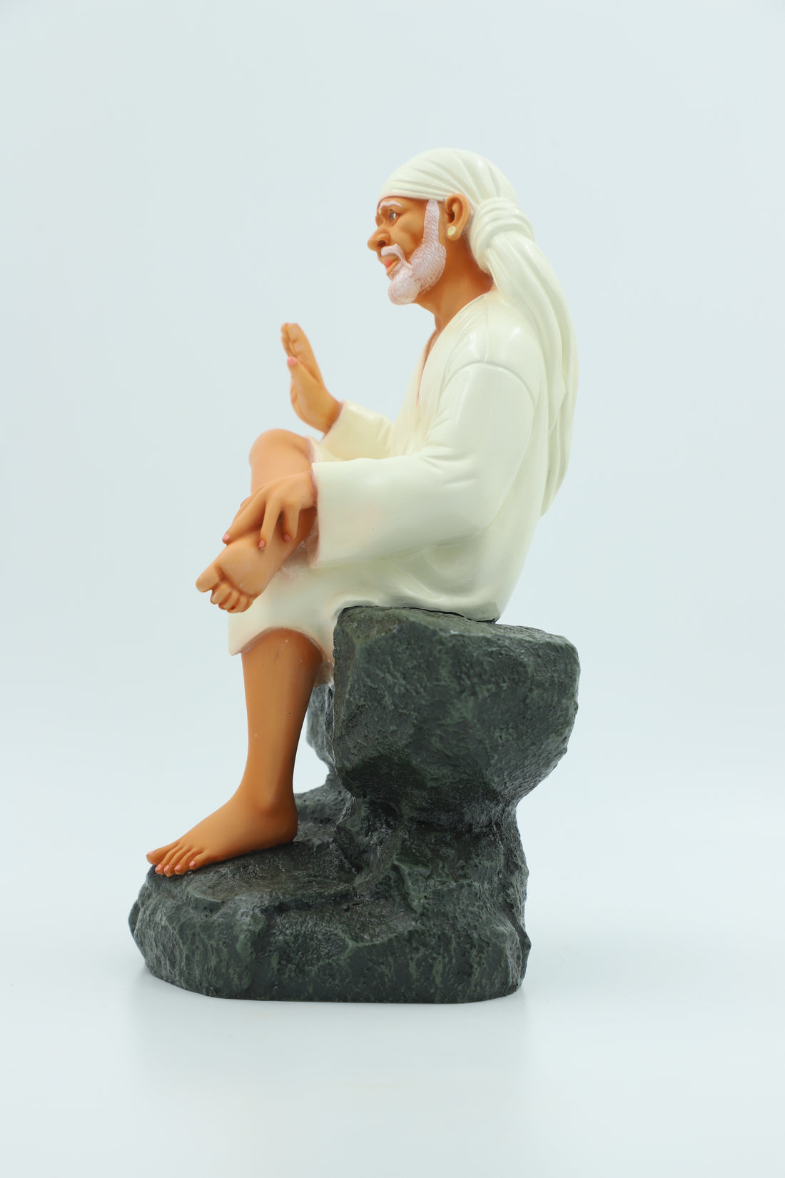 Saibaba Sitting on Stone Idol, Orange, 9 Inch Hemant Art