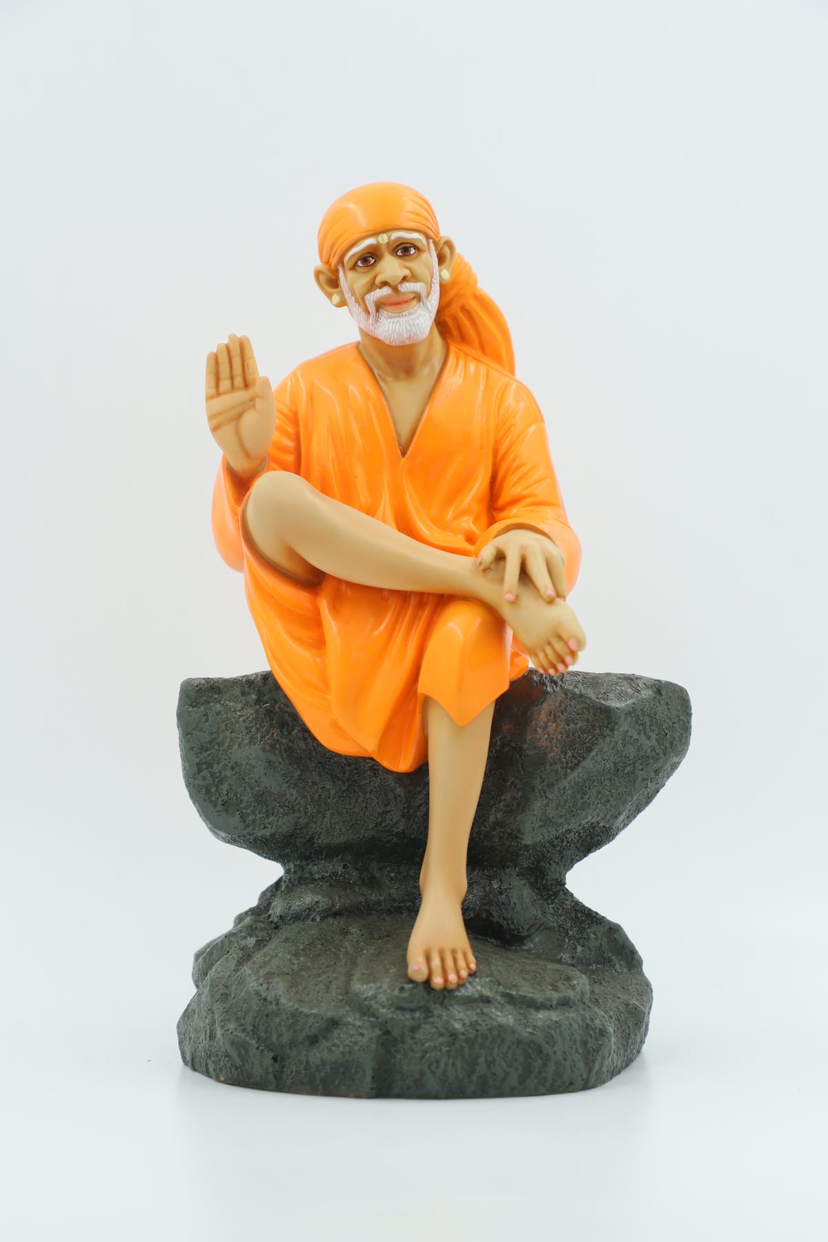 Saibaba Sitting on Stone Idol, Orange, 9 Inch Hemant Art
