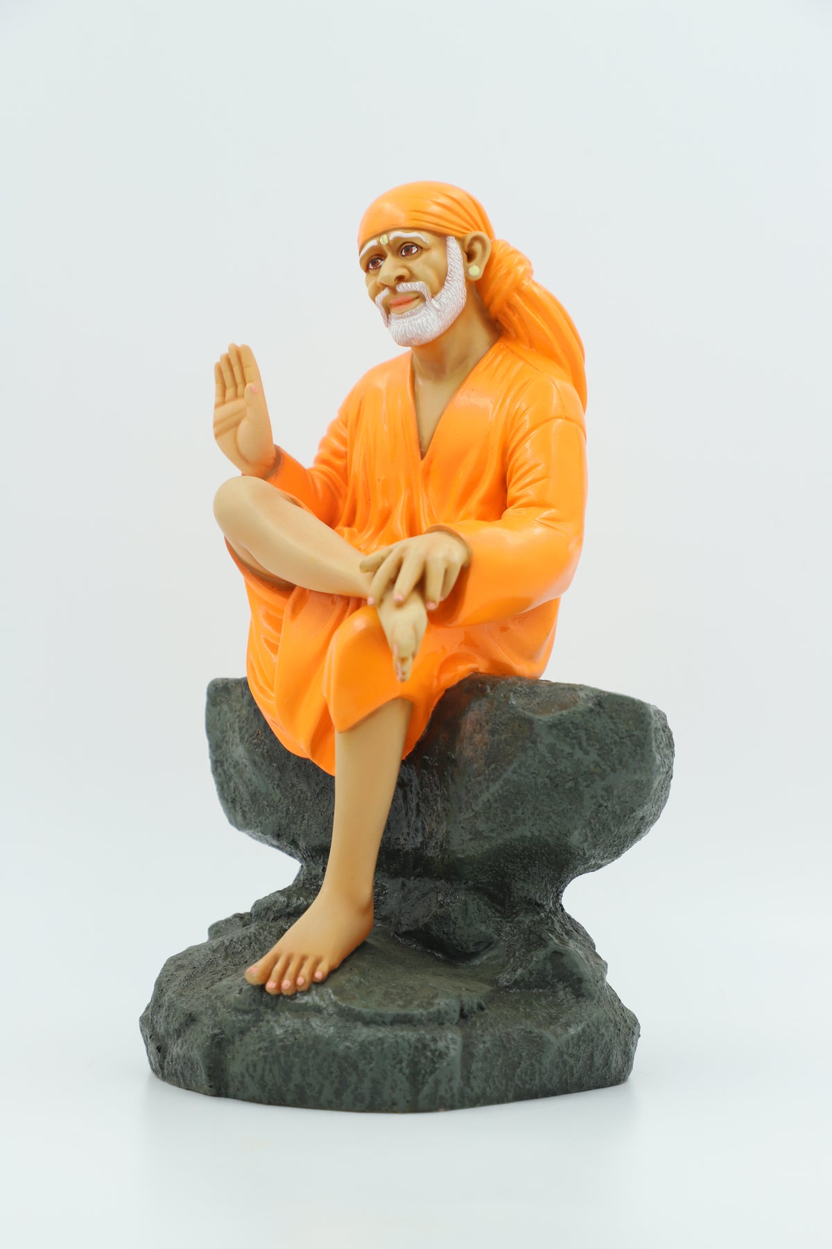 Saibaba Sitting on Stone Idol, Orange, 9 Inch Hemant Art