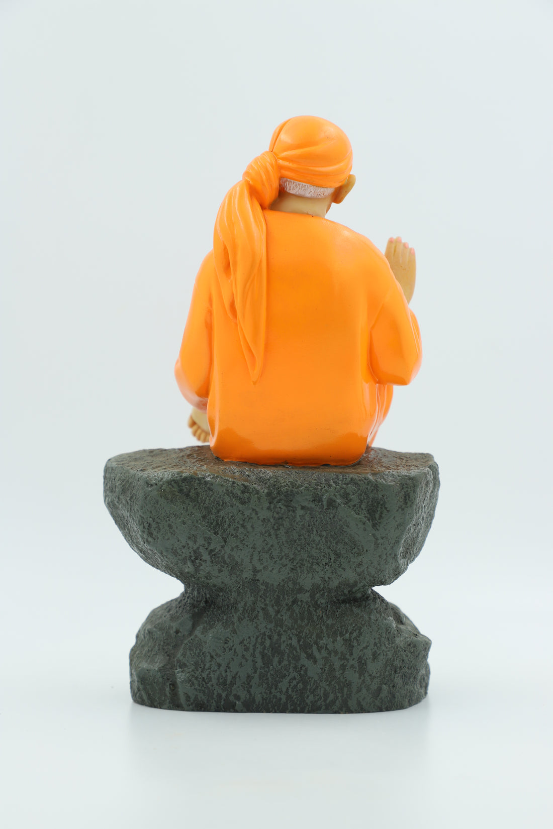 Saibaba Sitting on Stone Idol, Orange, 9 Inch Hemant Art