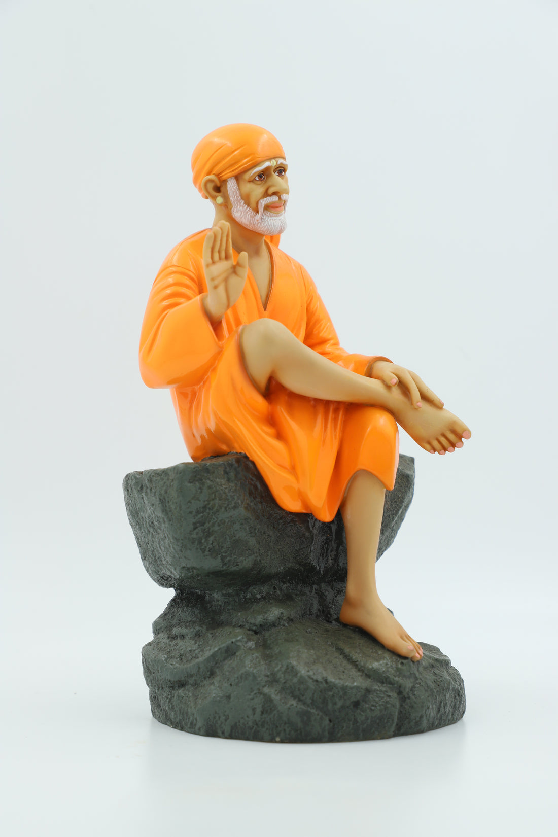 Saibaba Sitting on Stone Idol, Orange, 9 Inch Hemant Art