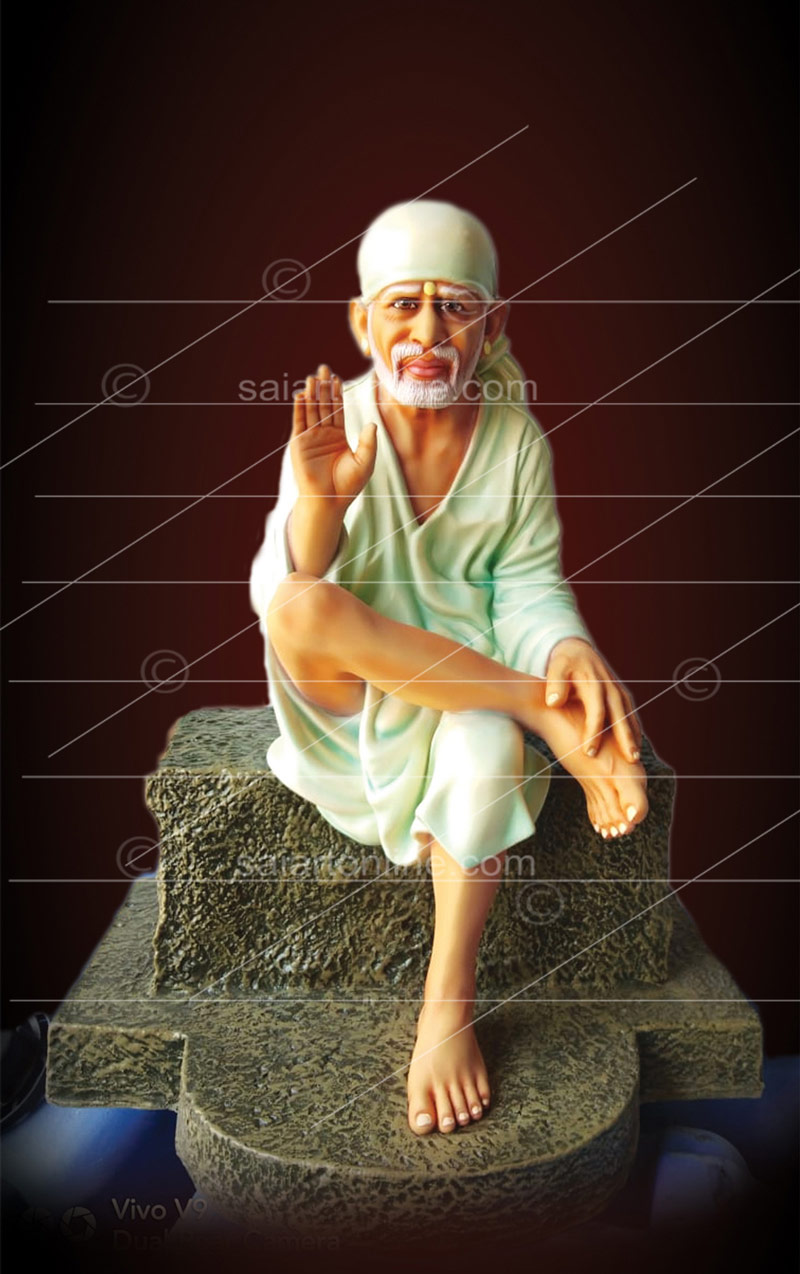 Statue - Buy Online Sai Baba Sitting on a Stone at best price in India