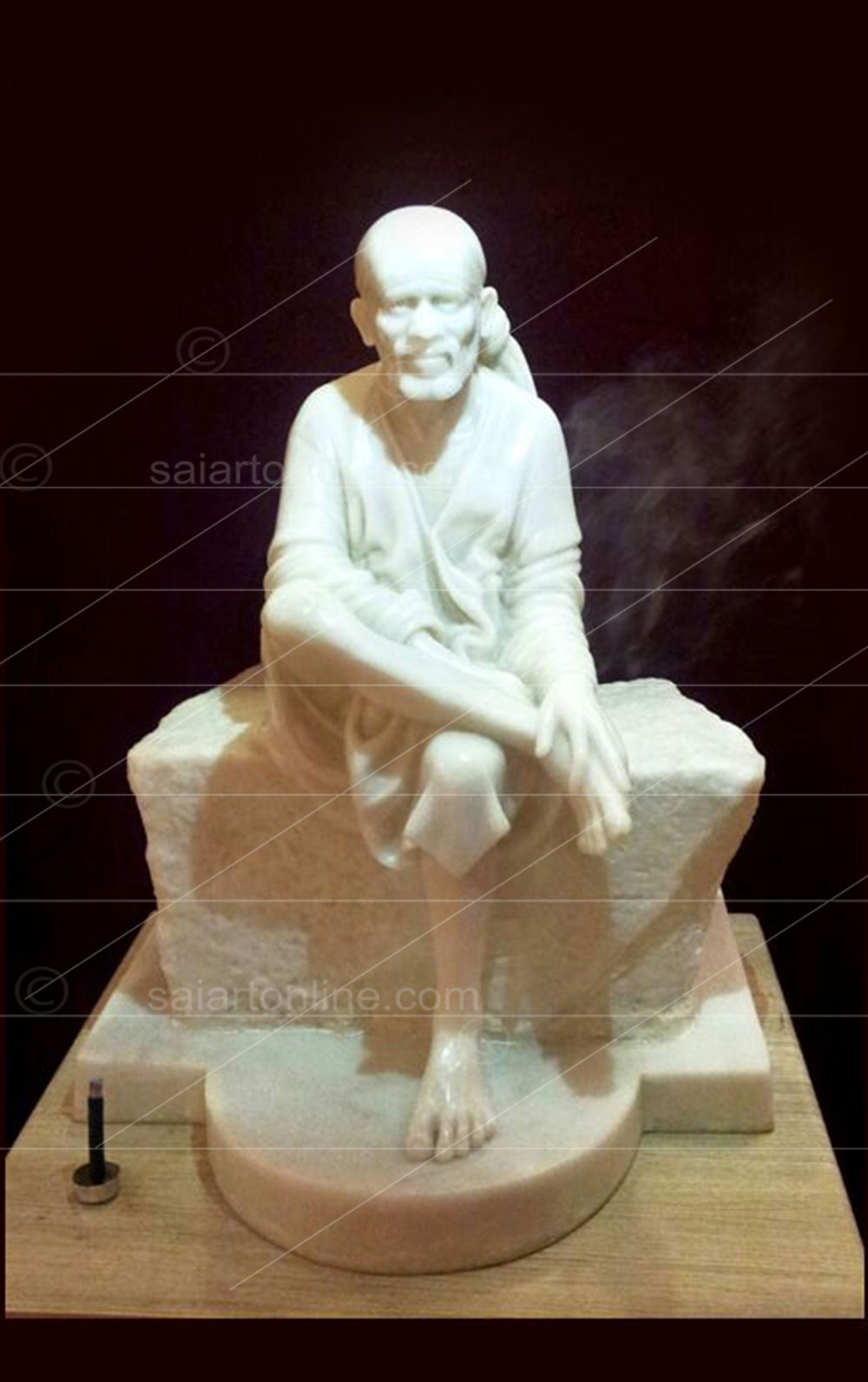sai-baba-sitting-on-white-stone-statue
